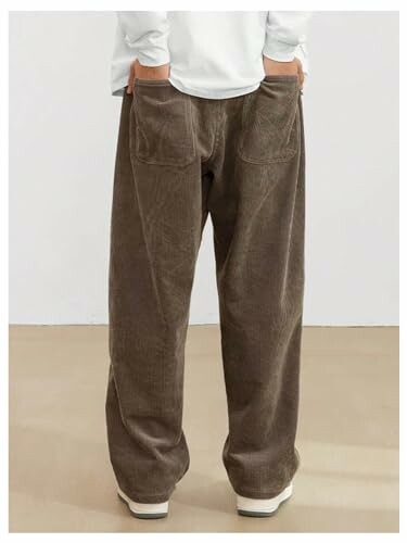 Person wearing brown corduroy pants from the back.