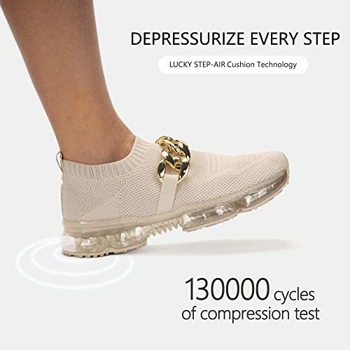Beige sneaker with gold chain on a transparent sole, showing compression test results.
