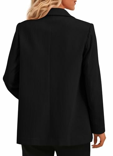 Back view of a woman wearing a black blazer