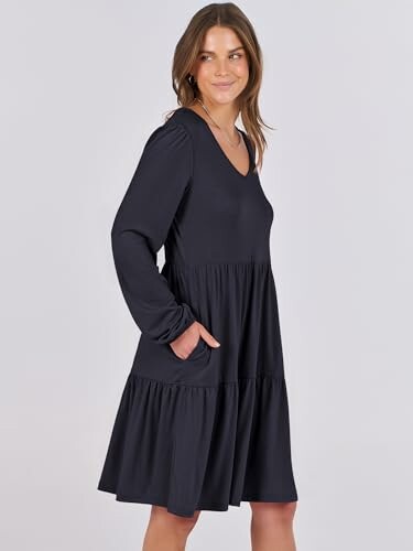 Woman wearing a black long-sleeve dress