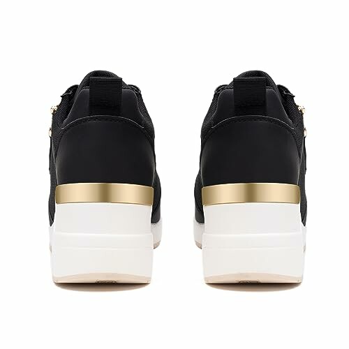 Rear view of black and gold platform sneakers