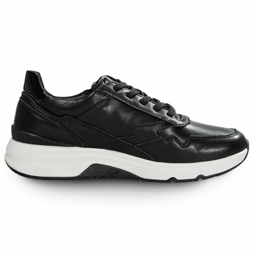 Black leather sneaker with white sole showing cushioning for comfort.