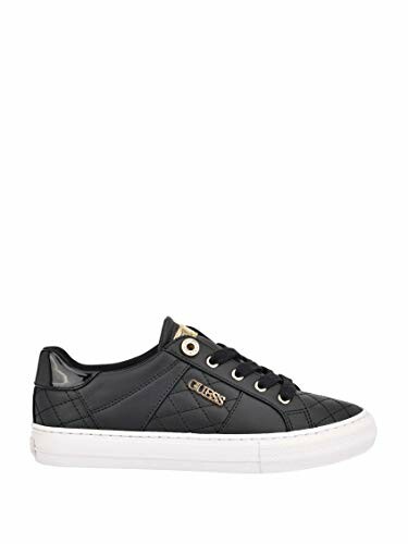 Black quilted sneaker with white sole and gold details.