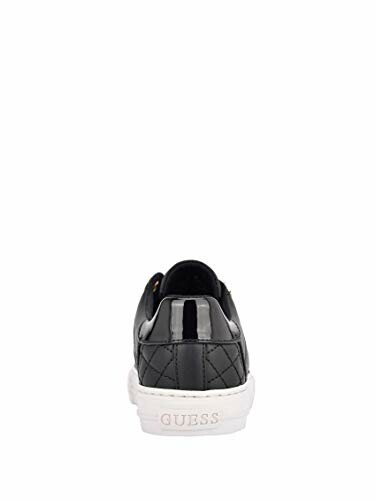 Back view of a black sneaker with white sole.