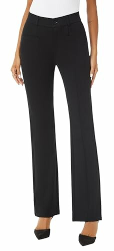 Woman wearing black trousers and black shoes