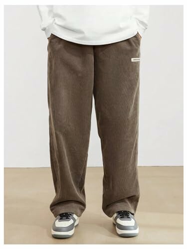 Person wearing brown corduroy pants and sneakers.