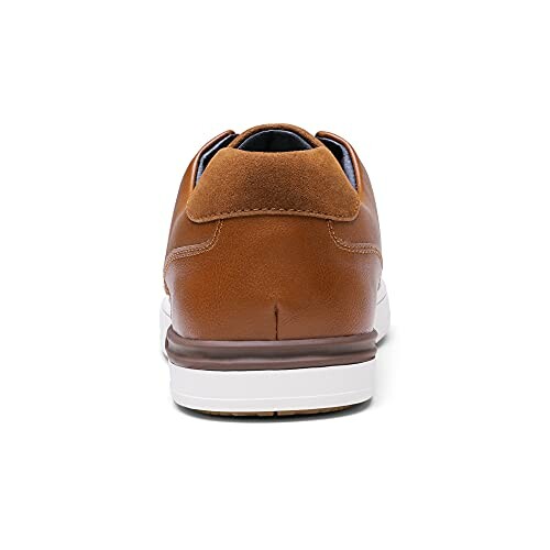 Back view of a brown leather sneaker with a white sole