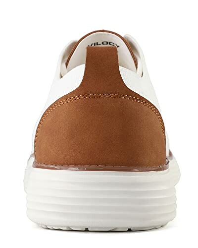Back view of a brown and white sneaker.