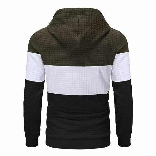 Back view of a colorblock hooded sweatshirt with green, white, and black sections.