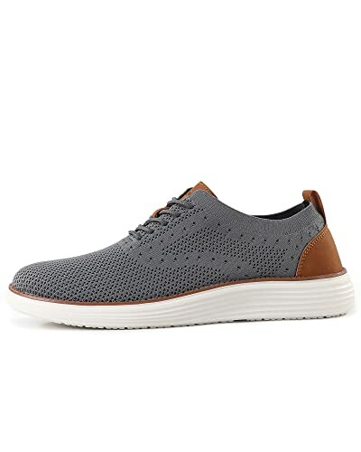Gray knit casual sneaker with white sole and brown accents