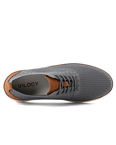 Top view of a gray casual shoe with brown accents