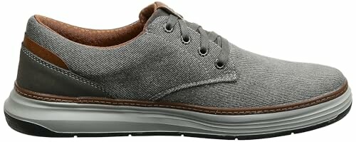 Gray casual sneaker with brown accents and white sole