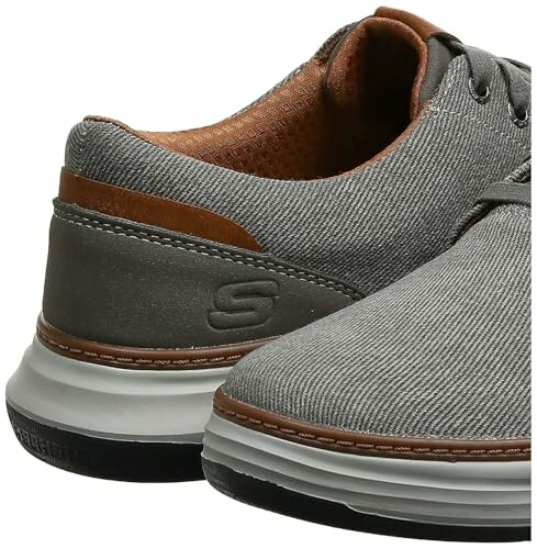 Gray casual shoes with brown accents