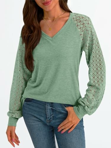 Woman wearing a green top with lace sleeves