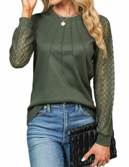 Woman wearing a green top with lace sleeves and holding a black clutch.
