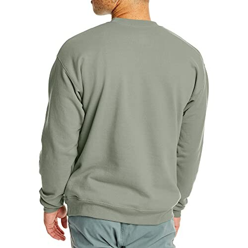 Back view of a person wearing a green sweatshirt.