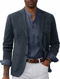 Man in a textured blazer with a blue shirt and white pants.