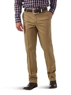 Man wearing khaki pants with a plaid shirt and cowboy boots.