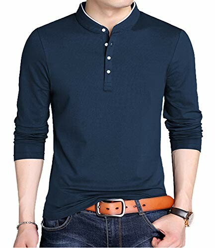 Man wearing a navy Henley shirt with jeans and a brown belt.