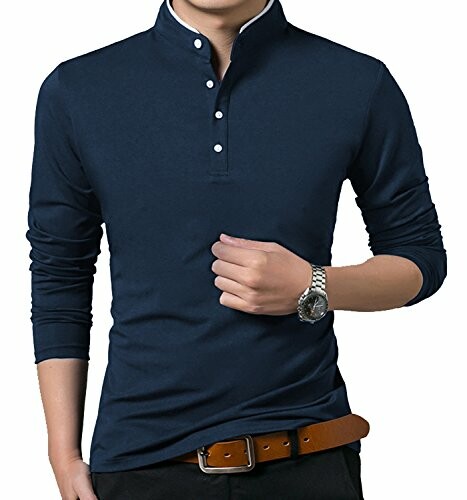 Man wearing a navy blue mandarin collar shirt with long sleeves.