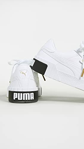 White Puma sneakers with black detailing on the heel.