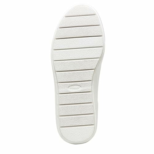 White sneaker sole with textured patterns.