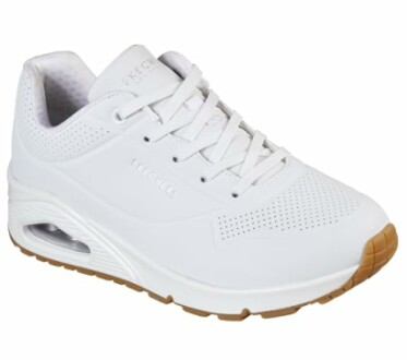 White sneaker with perforated design and gum sole.