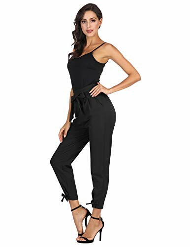 Woman wearing a black jumpsuit with heels