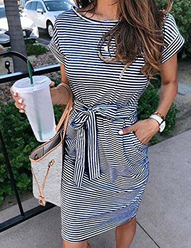 Woman in striped dress holding a drink and a bag