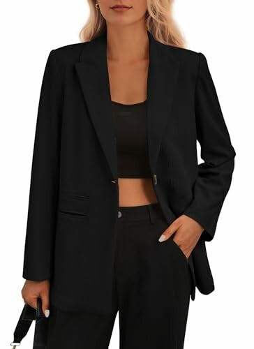 Woman wearing a black blazer and holding a bag