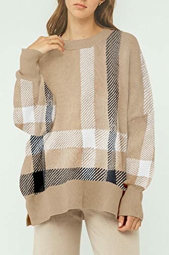 Woman wearing a beige plaid sweater