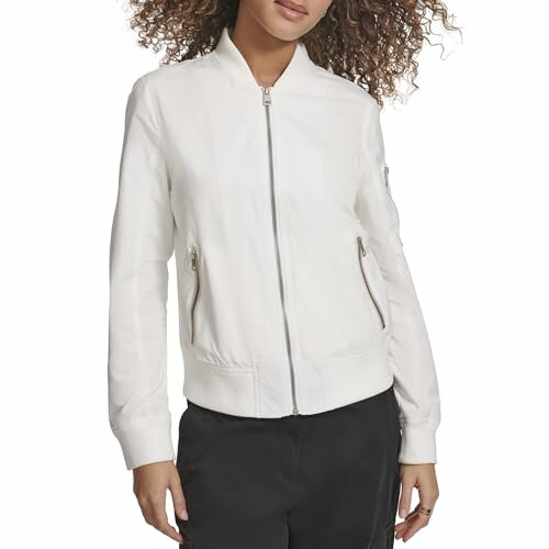 Woman wearing a white bomber jacket